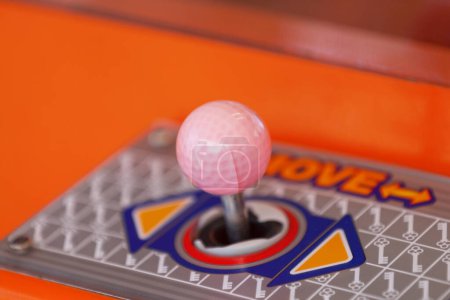Photo for Close-up on the joystick of a toy crane. - Royalty Free Image