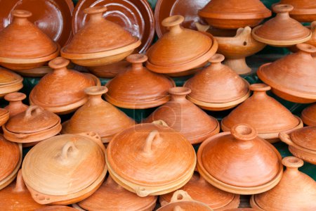 Photo for Rows of tajines (earthenware pot used to cook Maghrebi dishes also called tajine) for sale in the souk of Tanger. - Royalty Free Image