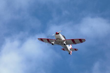 Téléchargez les photos : Close up on a white and red Mudry CAP 10B in flight. - en image libre de droit