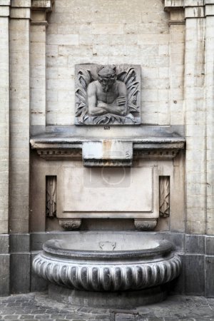 Photo for The "Fontaine Le Cracheur" (fountain the spitter) is a high-speed drinking water fountain located at the corner of Rue des Pierres and Rue du Marche au Charbon in the center of Brussels. - Royalty Free Image