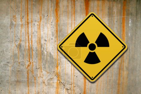 Photo for Diamond-shaped sign with yellow background and black border with a Ionizing radiation sign drawn in the middle. - Royalty Free Image