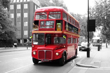 Photo for Black and white street of London with an isolated traditional red double-decker bus. - Royalty Free Image