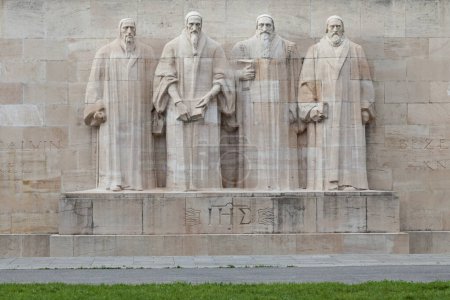 Photo for The Reformation Wall is a monument in Geneva, Switzerland inaugurated in 1909. At the centre of the Wall are statues to William Farel, John Calvin, Theodore Beza, and John Knox. The Christogram can be seen below the statues. - Royalty Free Image