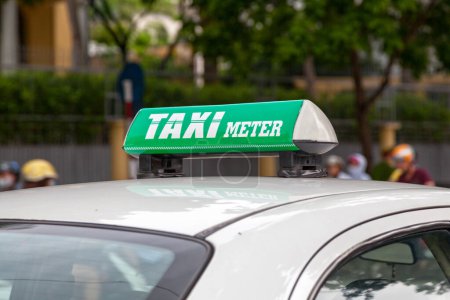 Photo for Close-up on a green taxi meter sign in Hanoi. - Royalty Free Image