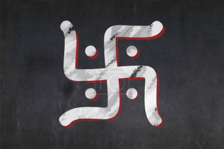 Photo for Blackboard with the Swastika symbol from Hinduism drawn in the middle. - Royalty Free Image