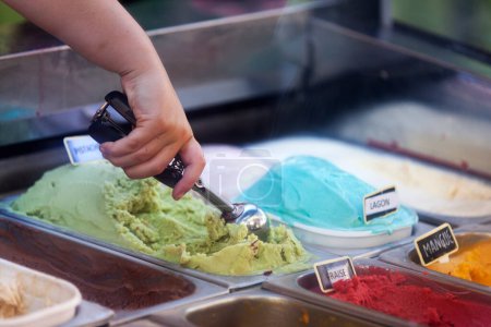 close up of scooping ice cream in gelato cafe