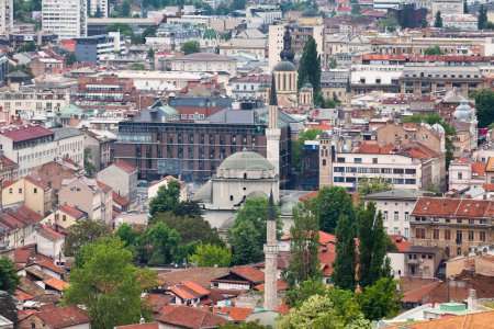 Photo for Sarajevo, Bosnia and Herzegovina - May 26 2019: Aerial view of the Gazi Husrev-beg Mosque surrounded by the  Clock Tower, the Bascarsija Mosque and the Cathedral Church of the Nativity of the Theotokos. - Royalty Free Image
