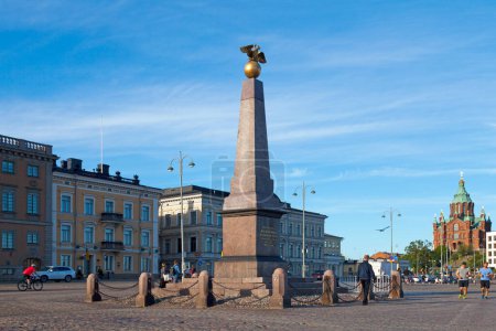 Photo for Helsinki, Finland - June 18 2019: The Imperial Stone is the oldest public monument in Helsinki, designed by Carl Ludvig Engel in 1833 at the Market Square. - Royalty Free Image