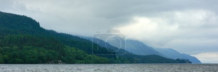 Photo for Loch Ness is a large freshwater loch in the Scottish Highlands extending for approximately 37 kilometres southwest of Inverness. - Royalty Free Image