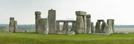 Photo for Amesbury, England: June 10, 2007: Tourists wander around the site of Stonehenge, a prehistoric monument in Wiltshire consisting of a series of standing stones. - Royalty Free Image