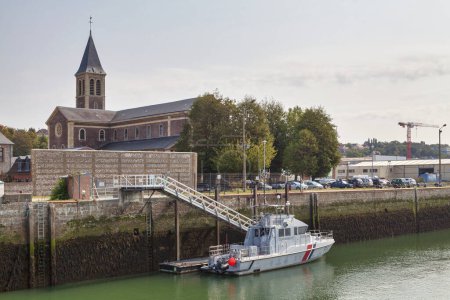 Photo for Dieppe, France - September 11 2020: Gendarmerie boat moored in front of the Notre-Dame-des-Greves church in Dieppe. - Royalty Free Image