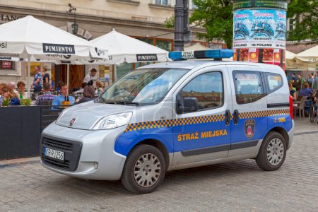 Photo for Krakow, Poland - June 06 2019: Municipal police car (Straz Miejska) parked at the main market square in the Old Town. - Royalty Free Image