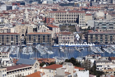 Photo for Marseille, France - March 23 2019: Aerial view of the Vieux Port with the Mairie de Marseille (English: City Hall), the Eglise des Accoules (English: Church of the Accoules) and the InterContinental Marseille - Hotel Dieu. - Royalty Free Image