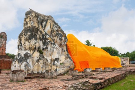 Photo for Recicling Buddha covered with an orange sari at Wat Lokaya Sutharam in Ayuthaya, Thailand - Royalty Free Image