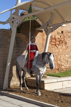 Photo for Rabat, Morocco - January 25 2018: A Royal Moroccan Guard mounted on a horse at the main entrance of the Yacoub al-Mansour esplanade. - Royalty Free Image