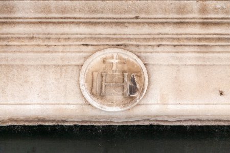 IHS Christogram carved above the entrance of a building in old town Dubrovnik.