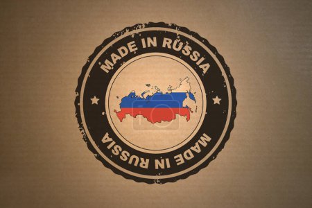 Brown paper with in its middle a retro style stamp Made in Russia include the map and flag of Russia.