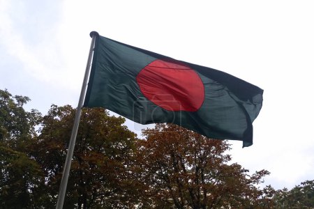 Flag of the Bangladesh waving in mid air.