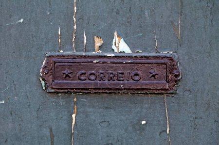 Mail slot with "Correio" written on it.