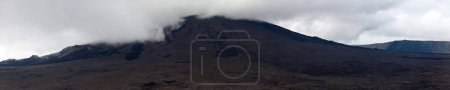 Piton de le Fournaise with the top covered by a cloud.