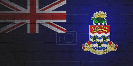 Flag of the Cayman Islands painted on a cinder block wall.