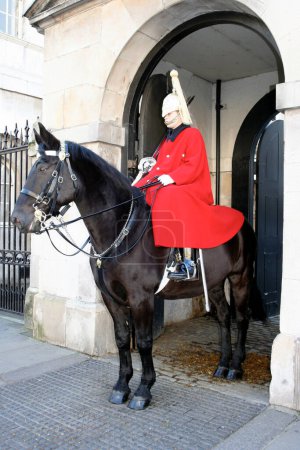 Photo for London, England: January 20 2007: Horse Guard on Horse back acting in his role as the Queen's personal bodyguard at the entrance of Whitehall Palace in London. - Royalty Free Image