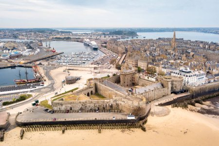 Photo for Saint-Malo, France - June 03 2020: Aerial view of the old town of Saint-Malo surrounded by ramparts with the Castle of the Duchess Anne, the Quic-en-Groigne Tower and the cathedral - Royalty Free Image