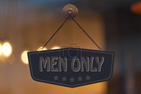 Foto de Old fashioned sign in the window of a shop saying in "Men only". - Imagen libre de derechos