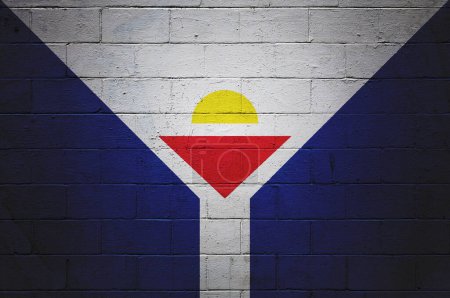 Flag of Saint Martin painted on a cinder block wall.