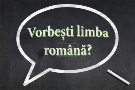 Blackboard with a bubble drawn in the middle with the short phrase in Romanian "Vorbesti limba romana?", meaning "Do you speak Romanian?".