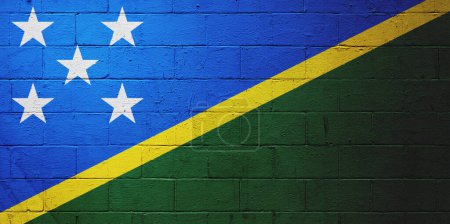 Flag of Solomon Islands painted on a cinder block wall.