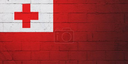 Flag of Tonga painted on a cinder block wall.