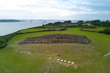 The Cairn of Barnenez is a Neolithic monument located near Plouezoc'h, on the Kernlhen peninsula in northern Finistere, Brittany (France). It dates to the early Neolithic, about 4800 BC; it is considered one of the earliest megalithic monuments 