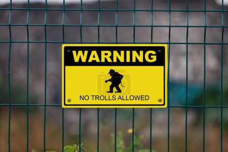 Black and yellow warning sign with a troll with written bellow it "No trolls allowed".