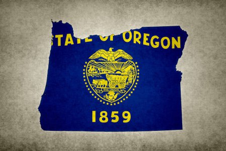 Carte grunge de l'État de l'Oregon (États-Unis) avec son drapeau imprimé à l'intérieur de sa frontière sur un vieux papier