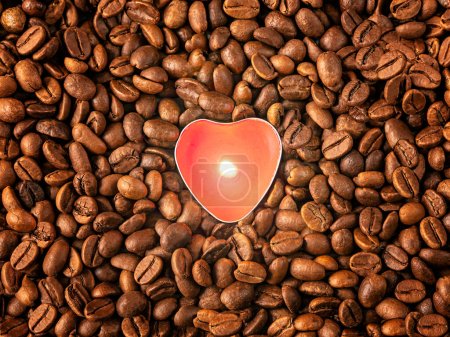 Coffee beans, burning red candle in the form of a heart background, top view. Coffee lover concept