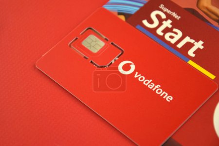 Photo for KHARKIV, UKRAINE - FEBRUARY 11, 2023: Vodafone starter pack on a red background. - Royalty Free Image