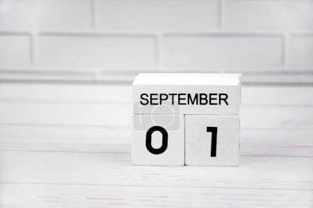 Photo for The white wooden perpetual calendar showing the 1st of September. - Royalty Free Image