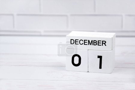 Photo for The white wooden perpetual calendar showing the 1st of December. - Royalty Free Image