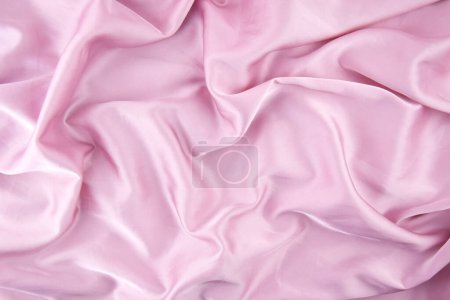 Pink chiffon fabric texture for background. Silk fabric. Selective focus.