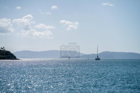 Photo for Tourist boats and tour boats in the whitsundays queensland, australia. travellers on the great barrier reef, over coral and fish. tourism yachts of young people - Royalty Free Image