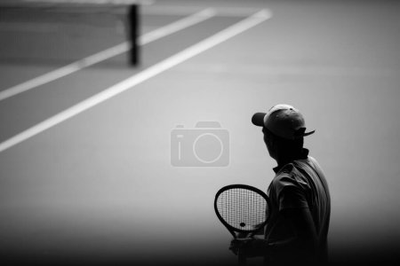 Photo for Professional athlete playing tennis on a sports court in europe. - Royalty Free Image