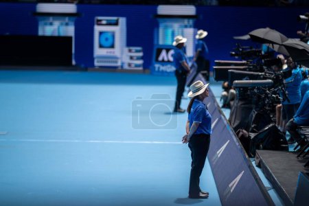 Photo for Public event with security guards on court at the tennis in melbourne australia in summer - Royalty Free Image