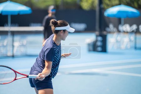 Photo for Female Professional athlete Tennis player playing on a court in a tennis tournament in summe - Royalty Free Image