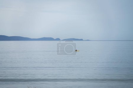 yellow canoe and kayak on a sandy beach in Australia in summer. kayaking 