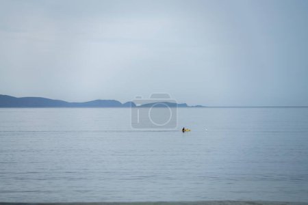 yellow canoe and kayak on a sandy beach in Australia in summer. kayaking 