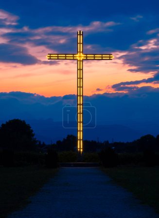 Photo for Brezje, Slovenia - July 28, 2022: A blue hour view at a large illuminated outdoor cross - Royalty Free Image