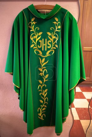 Green chasuble of the priest inside the sacristy of a Catholic church