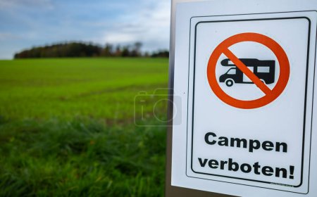 Photo for Traffic sign prohibiting camping of campers in nature in Oberembrach, Switzerland. English translation: Camping forbidden - Royalty Free Image