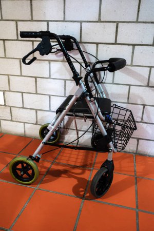 Photo for A rollator or walker is a mobile walking aid that consists of a support rod with wheels - Royalty Free Image